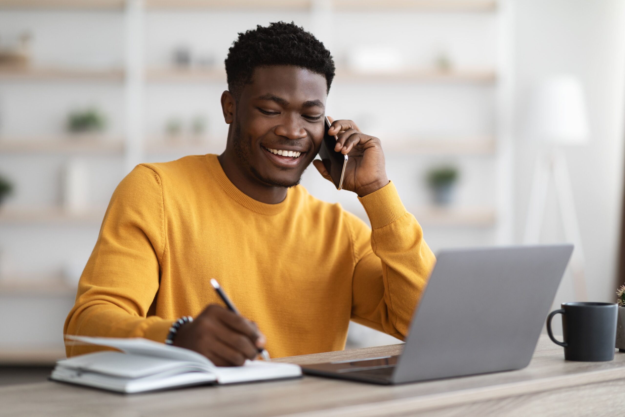 happy-black-man-freelancer-working-from-home-2023-11-27-05-16-21-utc